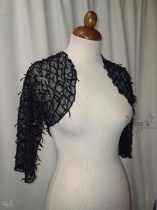 Coprispalle in paillettes.